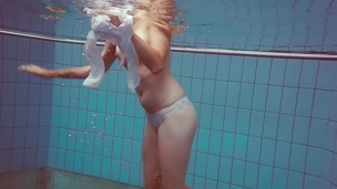 Melissa gets undressed underwater