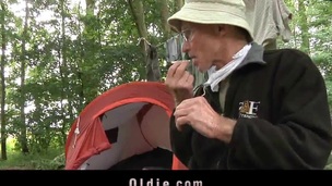 Young honey fucks 2 old hobos in the wood
