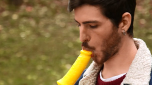 Guy engulfing a dick shaped ice cream at the park